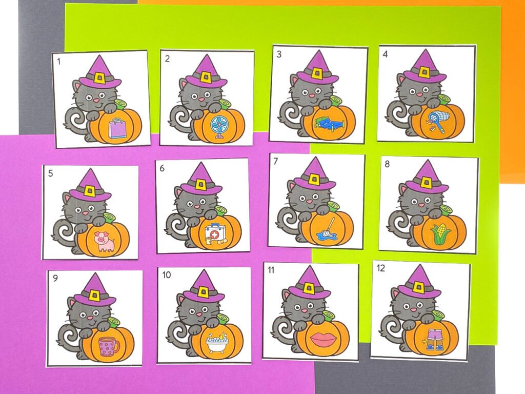 Halloween CVC Words Activity cards showing cats with pumpkins and picture clues to match and write CVC words.